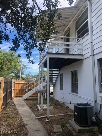 a front view of a house with parking area