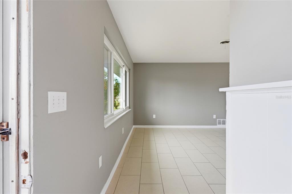 363 Glen Oak Road Venice, FL 34293 - Photo 10 of 53 a view of an empty room with a window