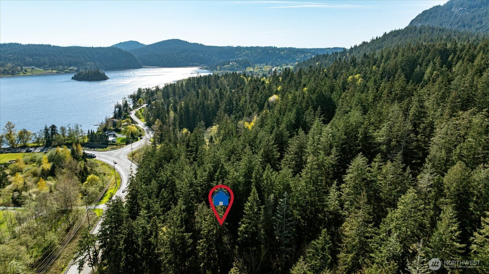 -xxx Campbell Lake Road Anacortes, WA 98221 - Photo 1 of 29 a view of a lush green field with a lake