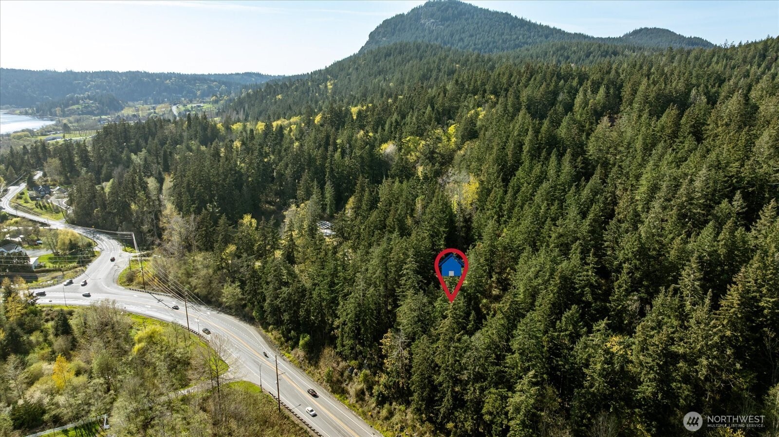 -xxx Campbell Lake Road Anacortes, WA 98221 - Photo 10 of 29 a view of a houses with a lush green forest
