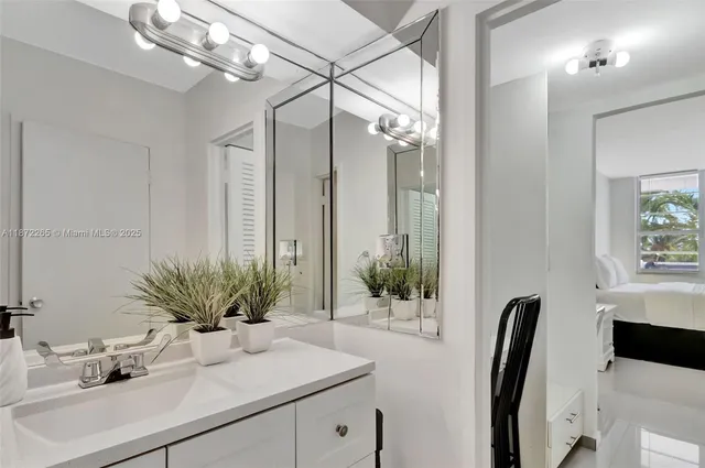 a view of a house with a large window and wooden fence