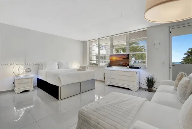 a living room with furniture and a lamp