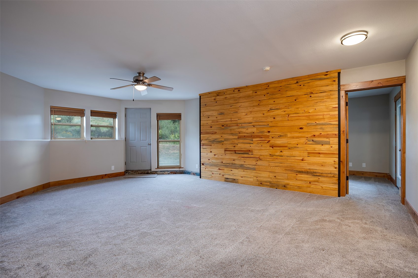 1170 Fish Creek Falls Road Steamboat Springs, CO 80487 - Photo 17 of 24 an empty room with windows and closet