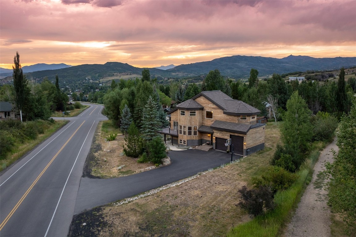 1170 Fish Creek Falls Road Steamboat Springs, CO 80487 - Photo 23 of 24 a view of house with mountain view in front of it