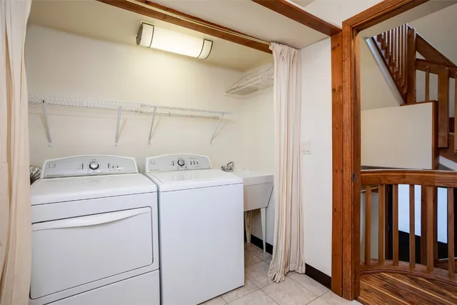 a view of storage and utility room with washer and dryer