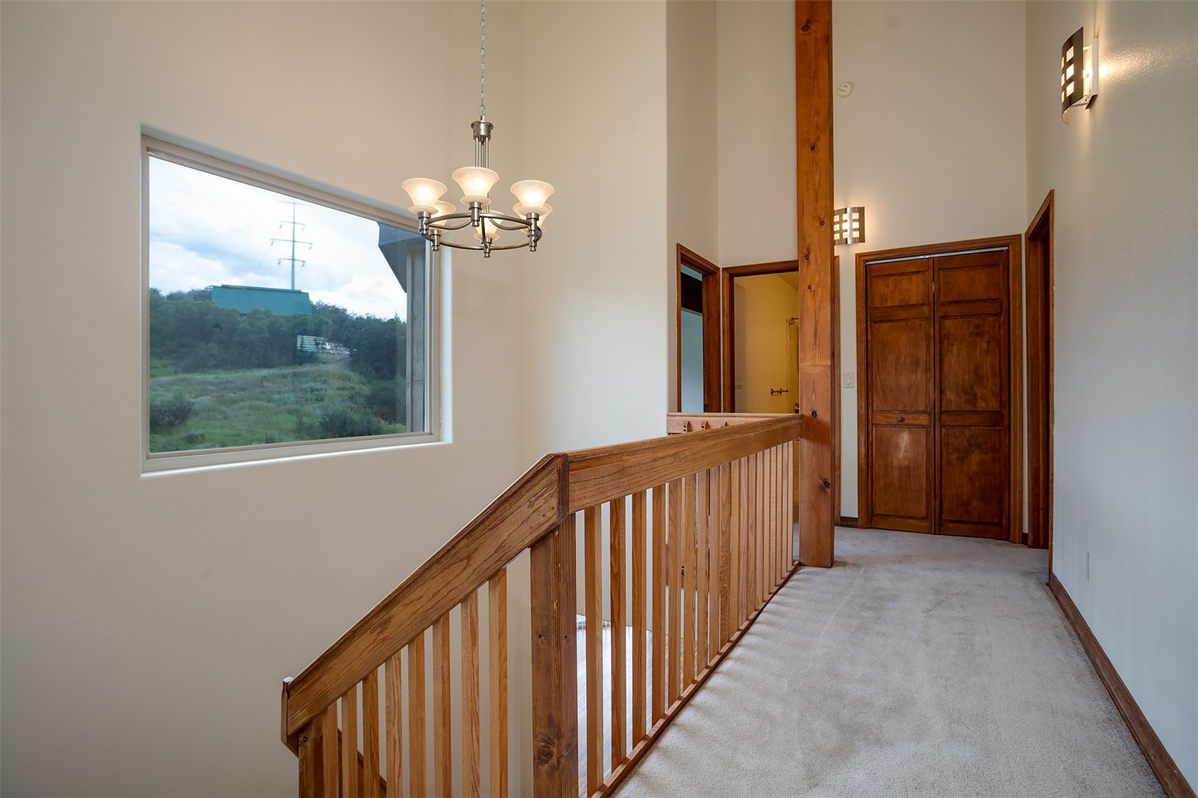 1170 Fish Creek Falls Road Steamboat Springs, CO 80487 - Photo 8 of 24 a view of a hallway to a livingroom with furniture