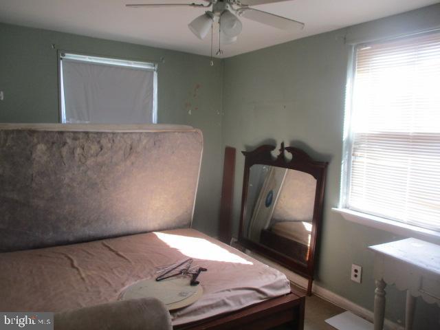 9612 Convent Avenue Philadelphia, PA 19114 - Photo 17 of 33 a bedroom with a bed and a chandelier
