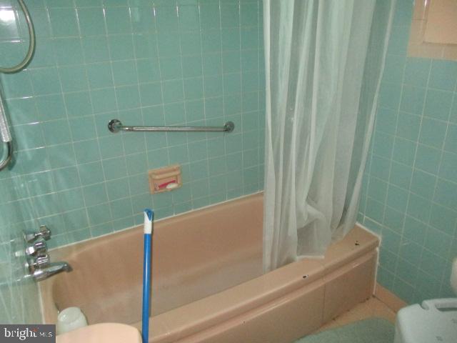 9612 Convent Avenue Philadelphia, PA 19114 - Photo 21 of 33 a bathroom with a bathtub and shower