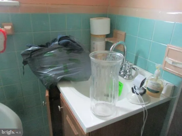 a bathroom with a sink and toilet