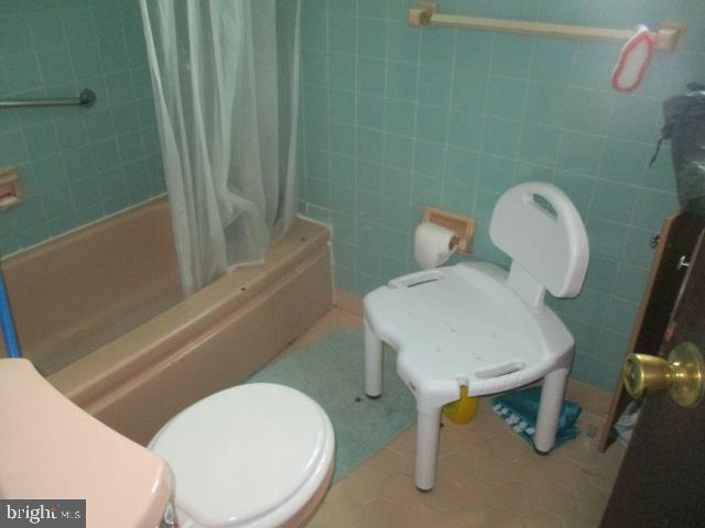 9612 Convent Avenue Philadelphia, PA 19114 - Photo 23 of 33 a white toilet sitting next to a bathroom sink and tub