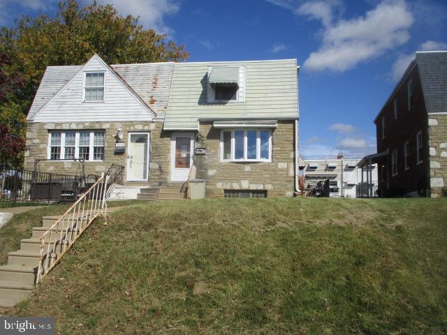 9612 Convent Avenue Philadelphia, PA 19114 - Photo 32 of 33 a front view of a house with a yard