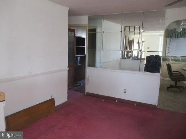 a view of a livingroom with furniture and staircase
