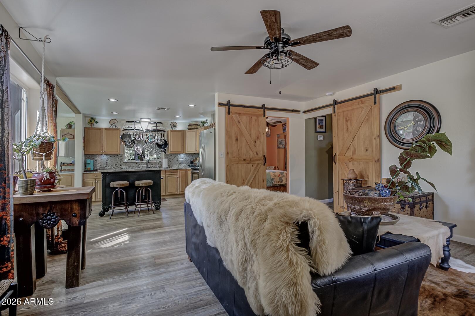 3762 Watertank Road Pine, AZ 85544 - Photo 6 of 38 a living room with furniture and a wooden floor