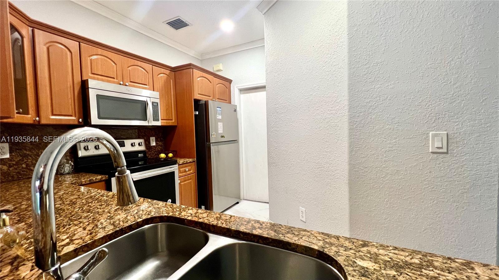 17014 Southwest 39th Street Miramar, FL 33027 - Photo 3 of 11 a bathroom with a sink and a bathtub