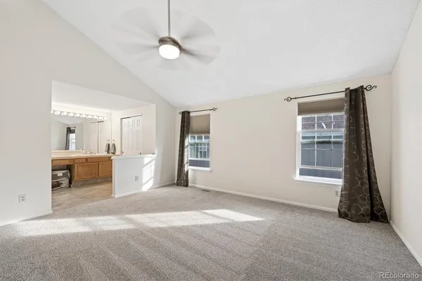 a view of livingroom with hardwood floor and a ceiling fan