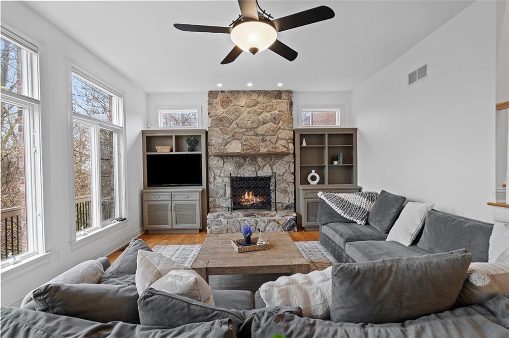 198 Camp Meeting Rd Extension Sewickley, PA 15143 - Photo 11 of 50 a living room with furniture a fireplace and a flat screen tv