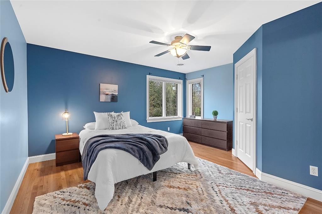 198 Camp Meeting Rd Extension Sewickley, PA 15143 - Photo 27 of 50 a bed room with a bed and a chandelier