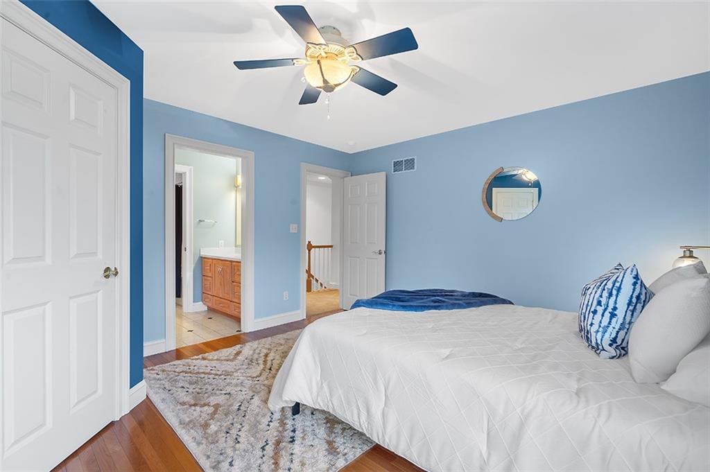 198 Camp Meeting Rd Extension Sewickley, PA 15143 - Photo 28 of 50 a bedroom with a bed and a chandelier