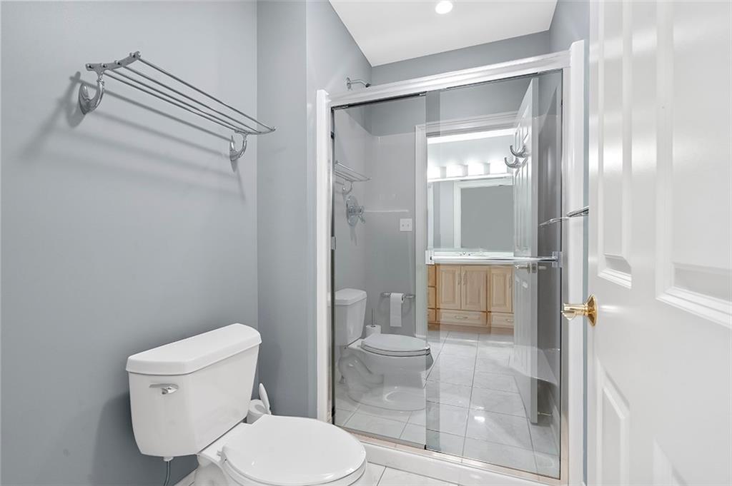 198 Camp Meeting Rd Extension Sewickley, PA 15143 - Photo 31 of 50 a bathroom with a toilet and a glass shower door