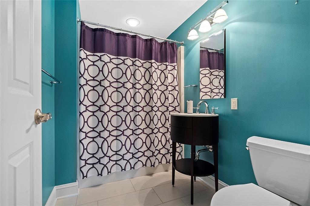 198 Camp Meeting Rd Extension Sewickley, PA 15143 - Photo 34 of 50 a bathroom with a toilet and a shower curtain