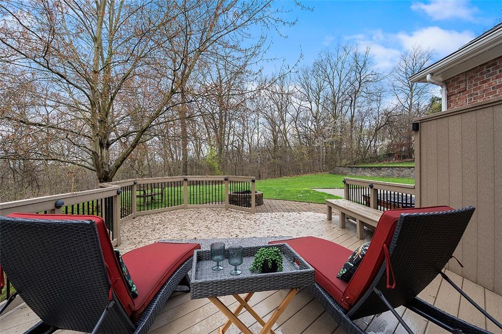 198 Camp Meeting Rd Extension Sewickley, PA 15143 - Photo 46 of 50 a view of a patio with table and chairs a barbeque with a floor to ceiling window