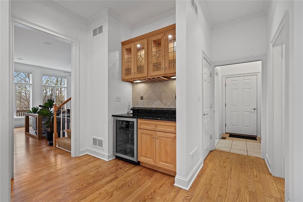 198 Camp Meeting Rd Extension Sewickley, PA 15143 - Photo 10 of 50 a view of a hallway with wooden floor and a living room