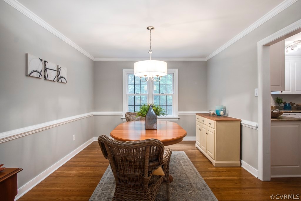 13805 Sterlings Bridge Road Midlothian, VA 23112 - Photo 11 of 24 a dining room with furniture a chandelier and wooden floor