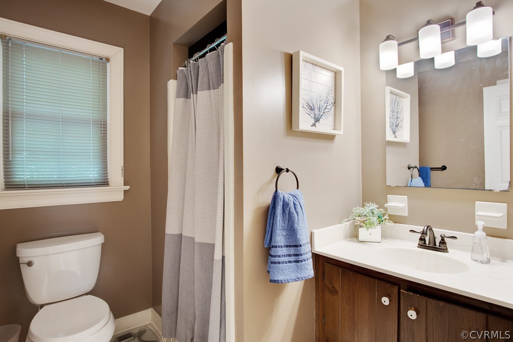 13805 Sterlings Bridge Road Midlothian, VA 23112 - Photo 19 of 24 a bathroom with a toilet sink and mirror