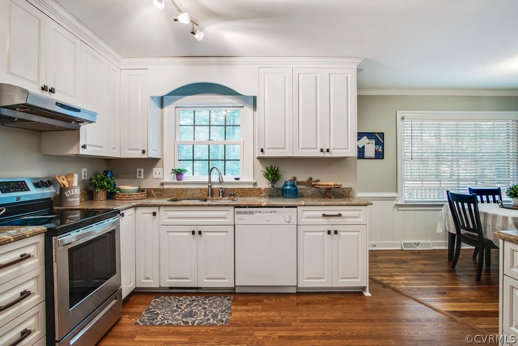13805 Sterlings Bridge Road Midlothian, VA 23112 - Photo 8 of 24 a kitchen with granite countertop a stove a sink and white cabinets with wooden floor
