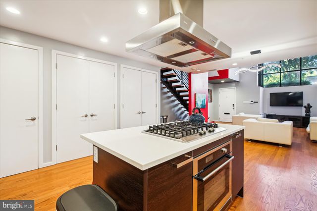 a view of kitchen island with furniture and wooden floor