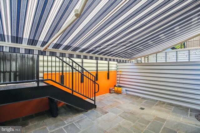 a view of swimming pool with an outdoor seating