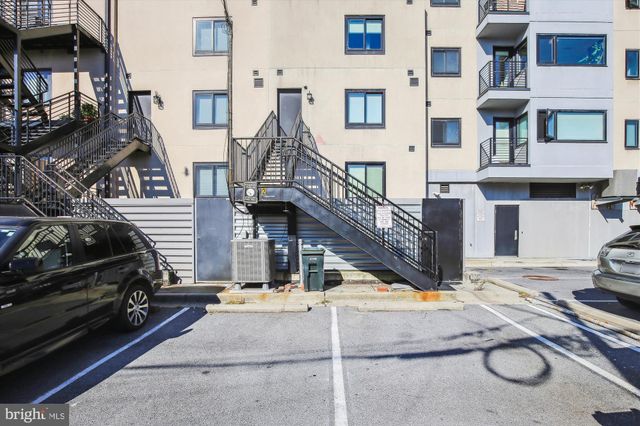 a view of a car park in front of house