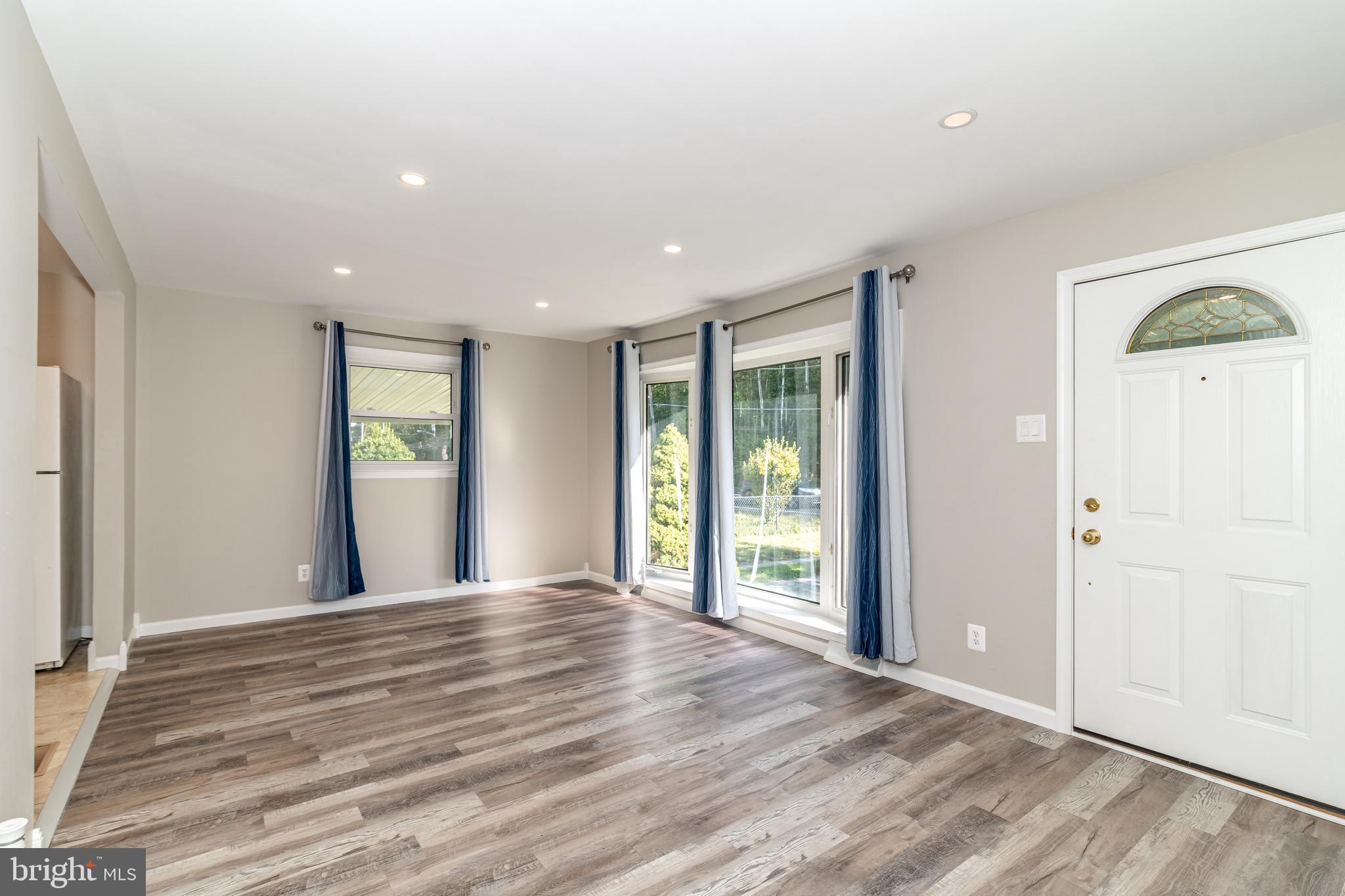 400 East Main Street Marlton, NJ 08053 - Photo 2 of 30 a view of an empty room with wooden floor and a window