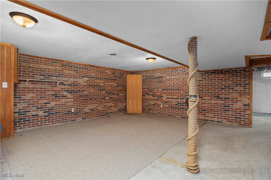 14015 West Lake Road Vermilion, OH 44089 - Photo 44 of 50 Unfurnished living room with concrete flooring