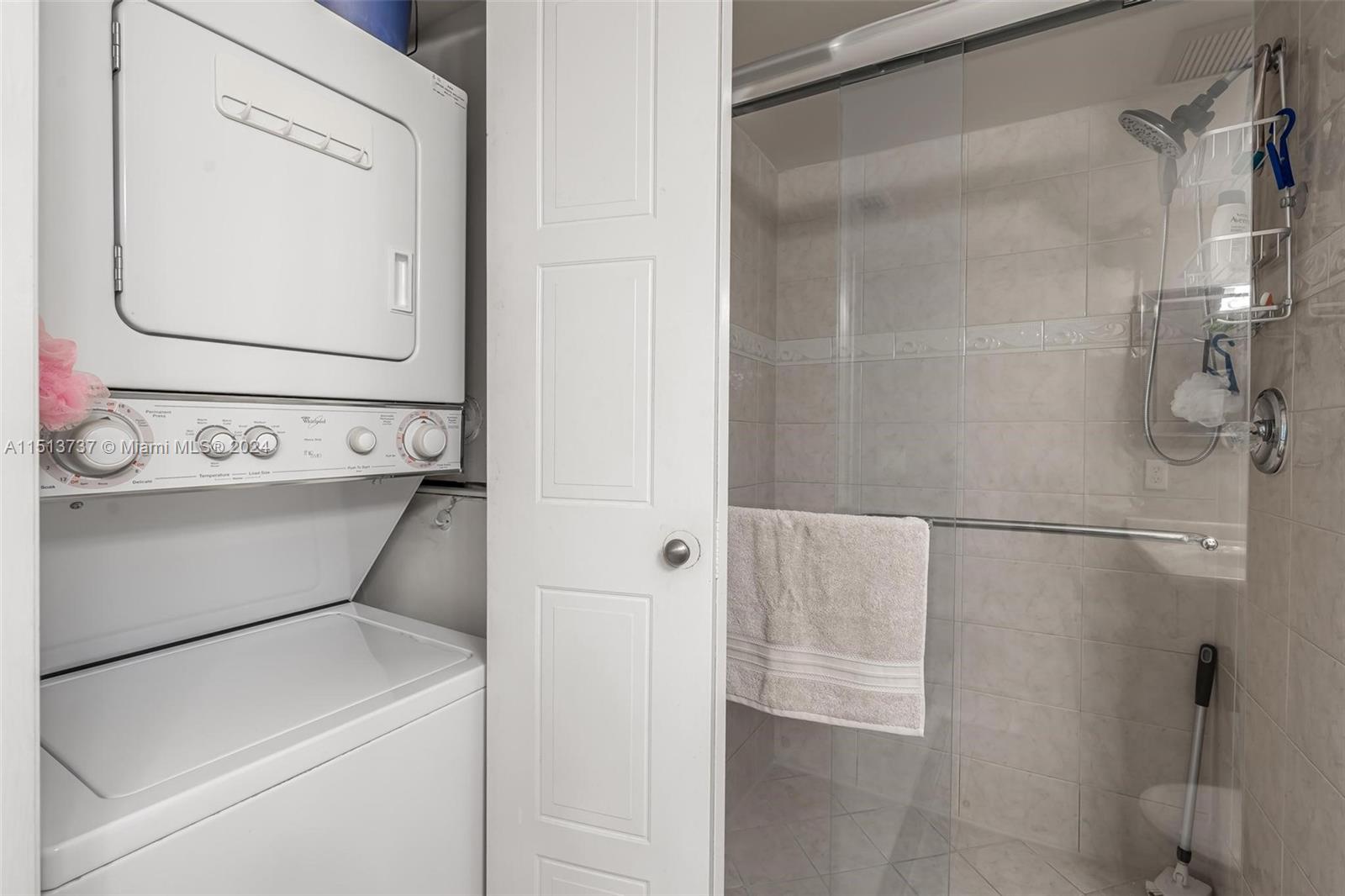 304 Racquet Club Road, Unit 101 Weston, FL 33326 - Photo 19 of 29 a utility room with dryer and washer
