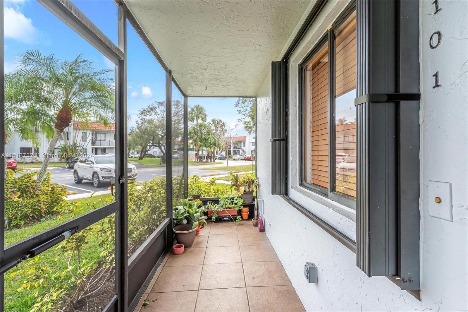 304 Racquet Club Road, Unit 101 Weston, FL 33326 - Photo 23 of 29 a view of a large room with an outdoor space