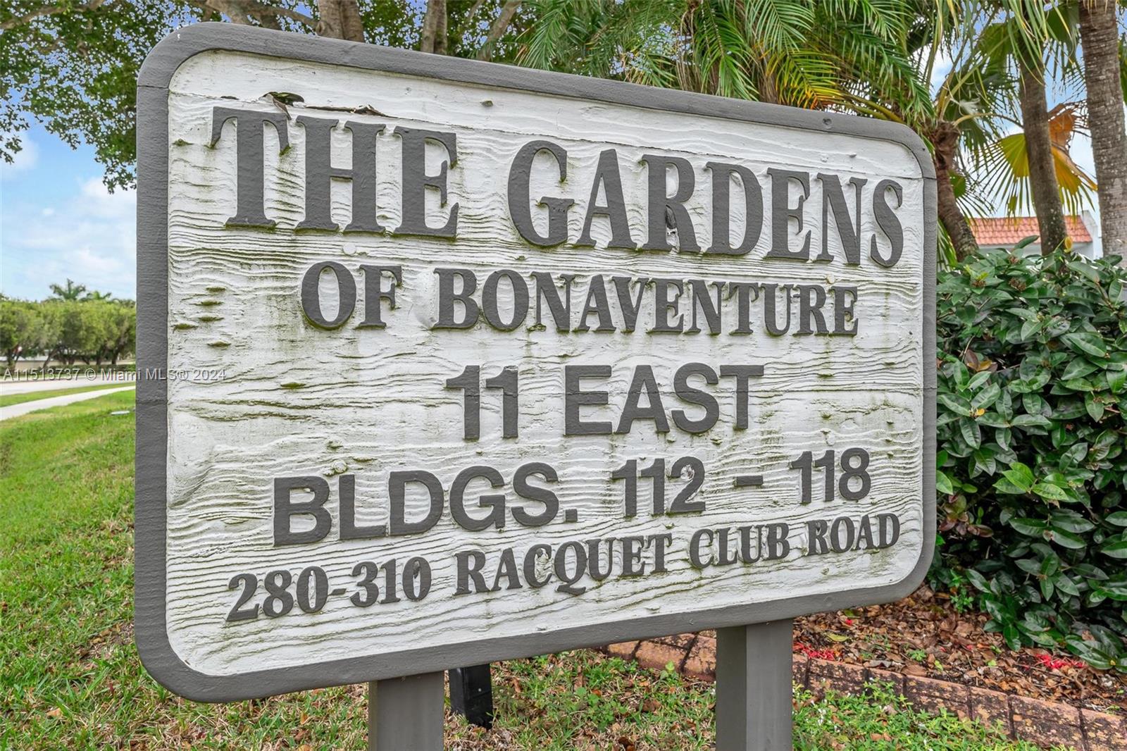 304 Racquet Club Road, Unit 101 Weston, FL 33326 - Photo 25 of 29 a sign on a pole on a street