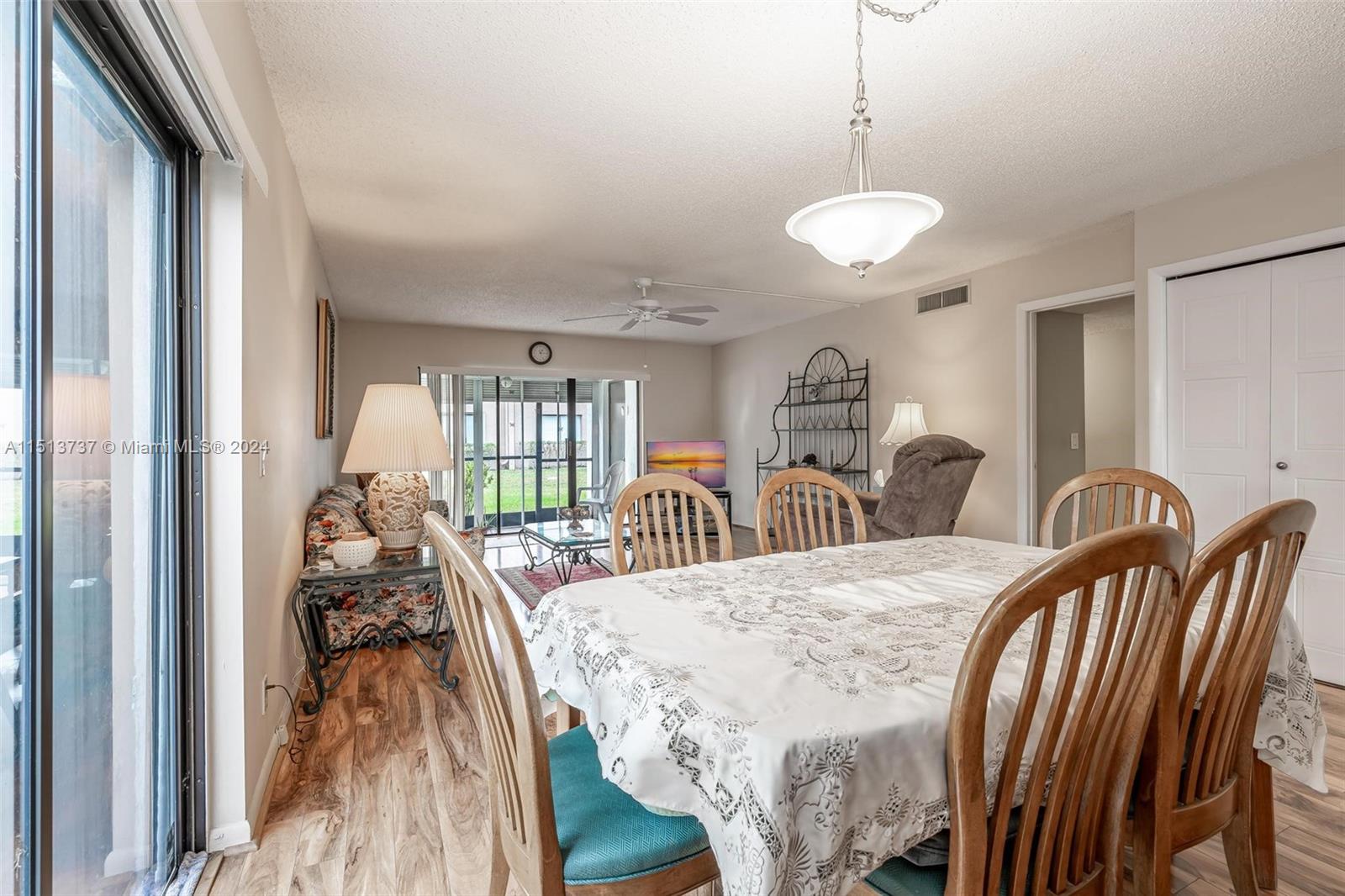 304 Racquet Club Road, Unit 101 Weston, FL 33326 - Photo 7 of 29 a view of a dining room with furniture