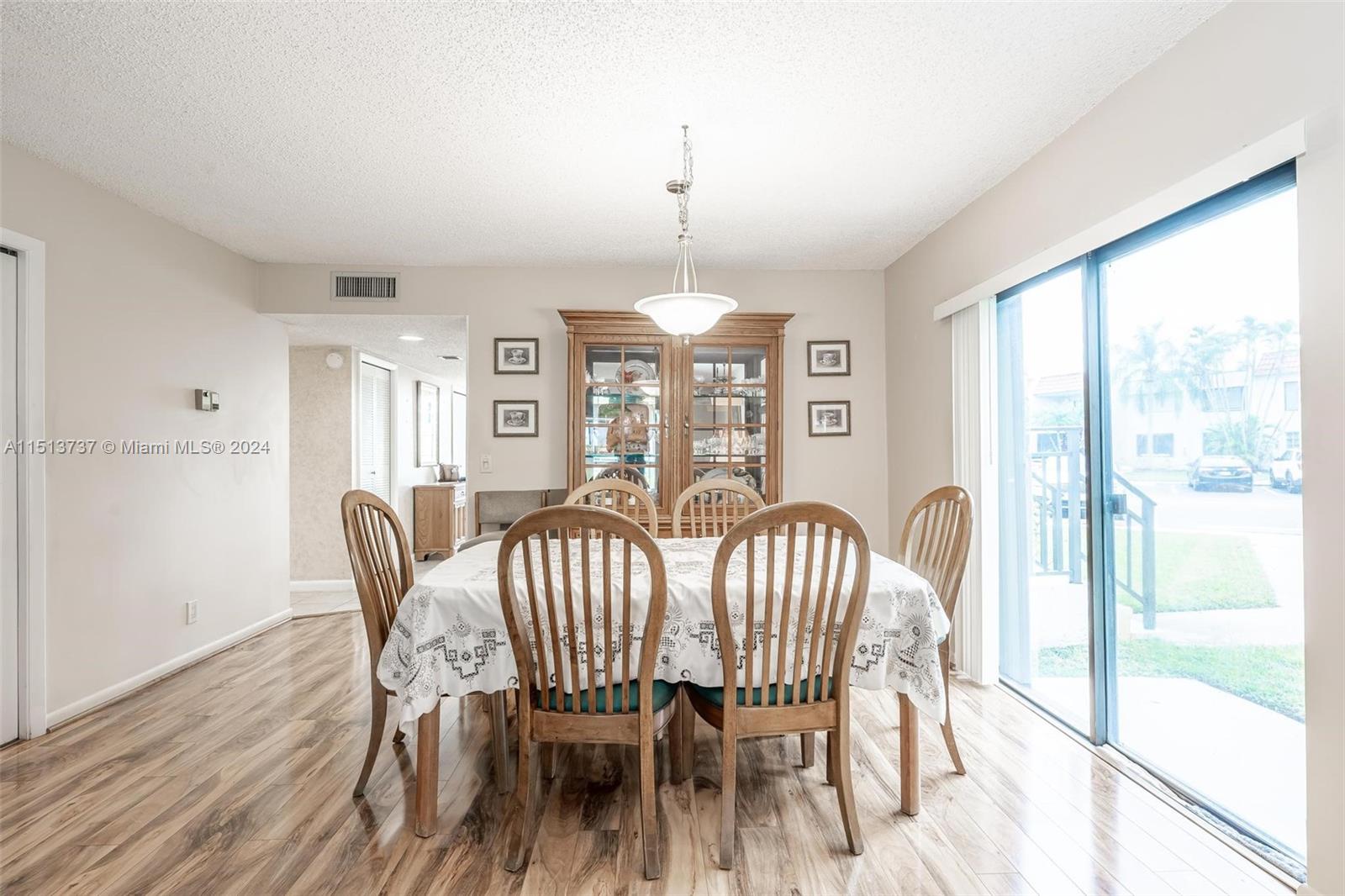 304 Racquet Club Road, Unit 101 Weston, FL 33326 - Photo 8 of 29 a view of a dining room with furniture window and outside view