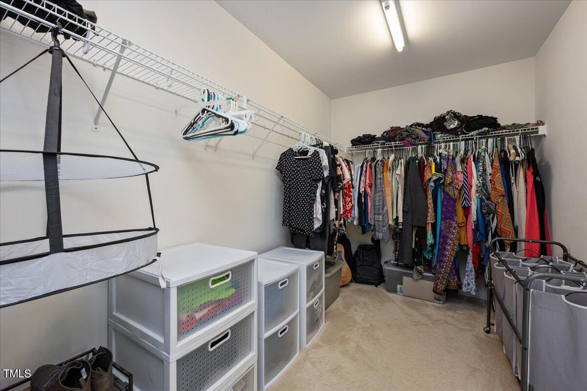 237 Mickleson Ridge Drive Raleigh, NC 27603 - Photo 23 of 42 a view of walk in closet with clothes