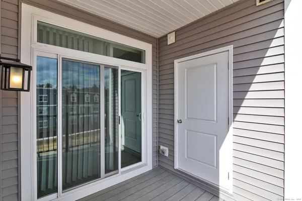 a view of front door and deck