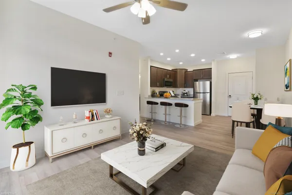 a living room with furniture and a flat screen tv