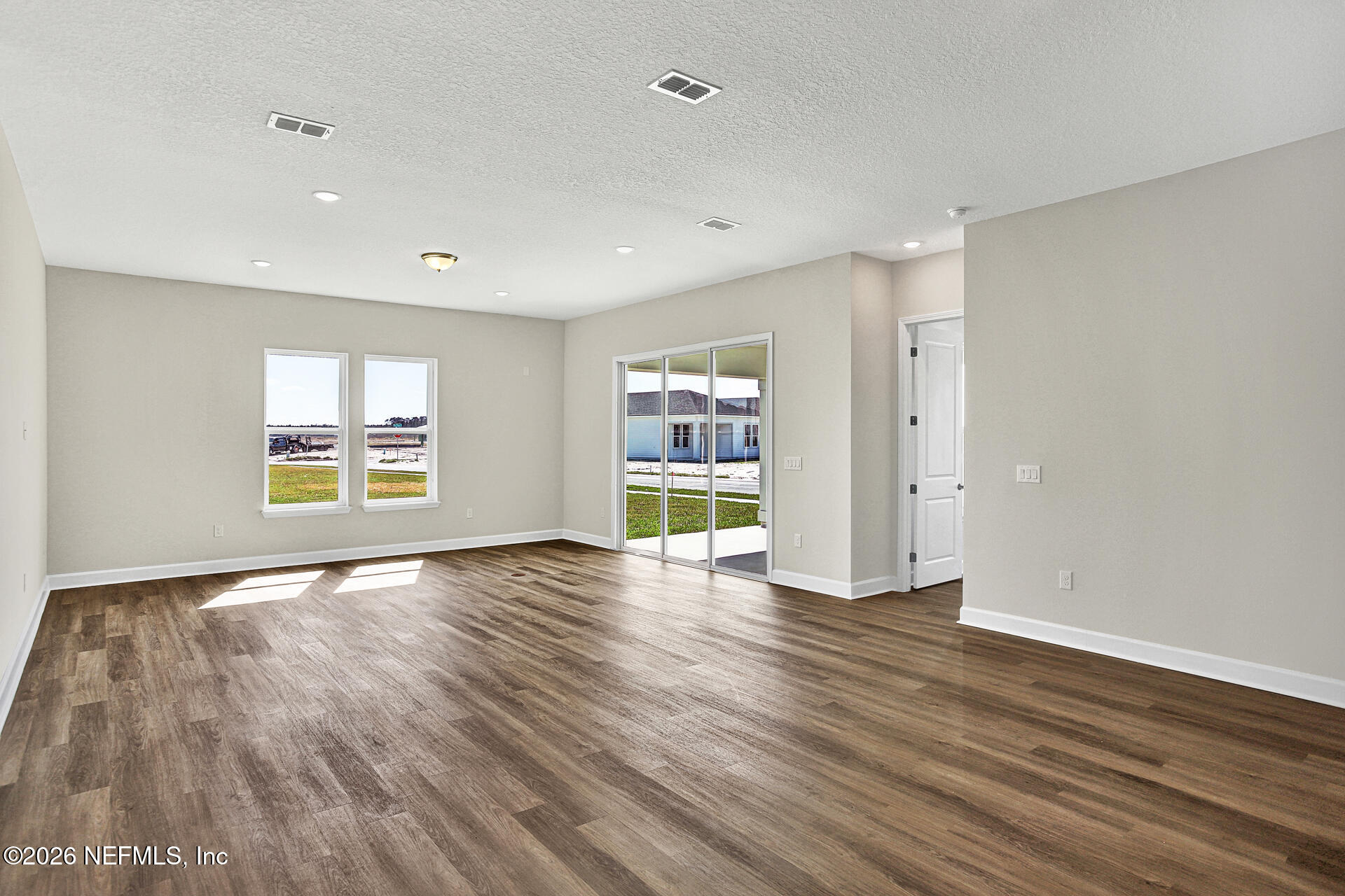 61 Ribera Drive Flagler Beach, FL 32136 - Photo 14 of 21 a view of an empty room with wooden floor and window