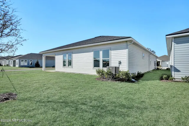 a view of a kitchen with wooden floor and cabinets