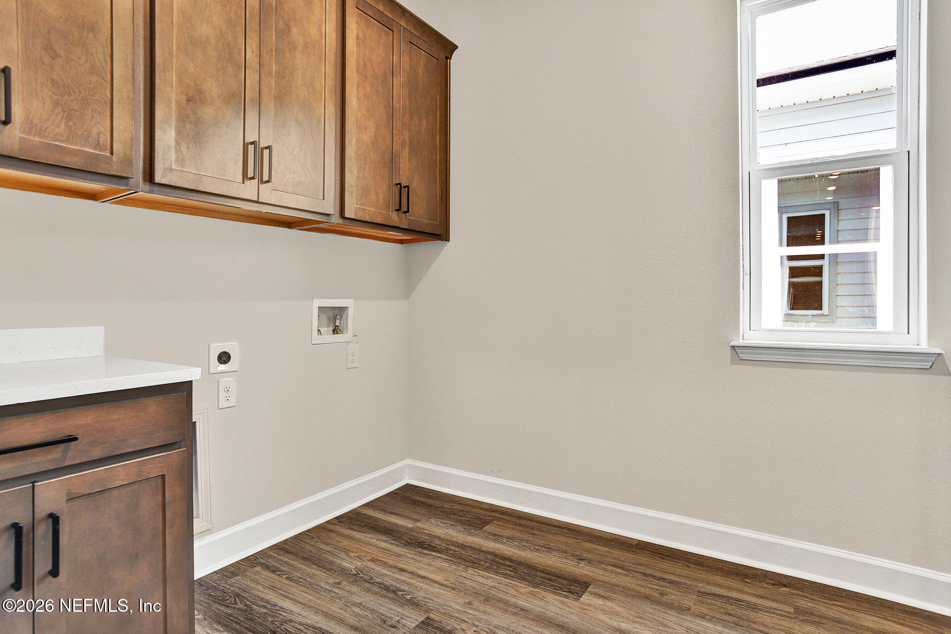 61 Ribera Drive Flagler Beach, FL 32136 - Photo 10 of 21 a view of a kitchen with wooden floor and cabinets