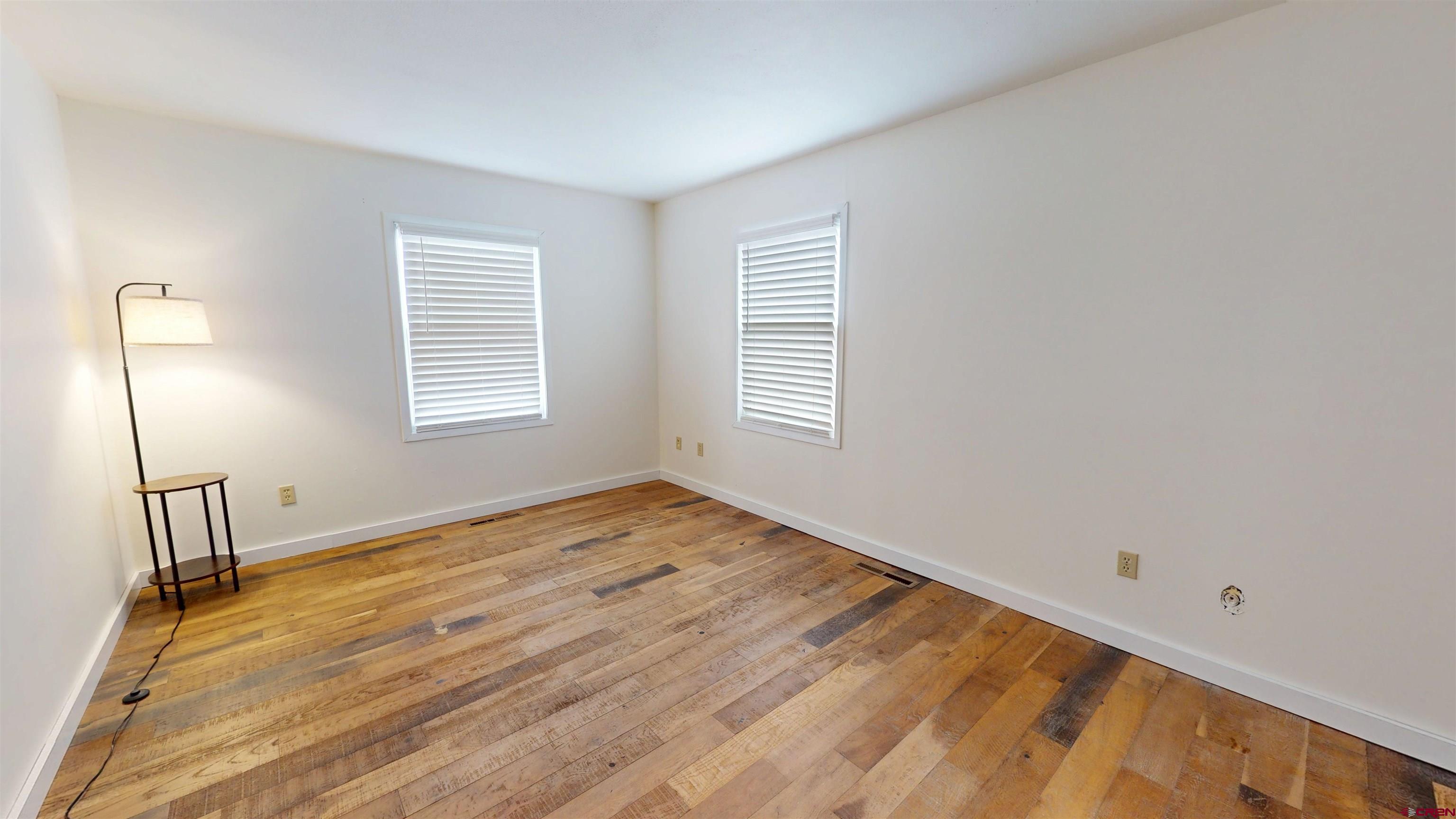 577 Pashuta Drive Gunnison, CO 81230 - Photo 15 of 41 a view of empty room with wooden floor and fan