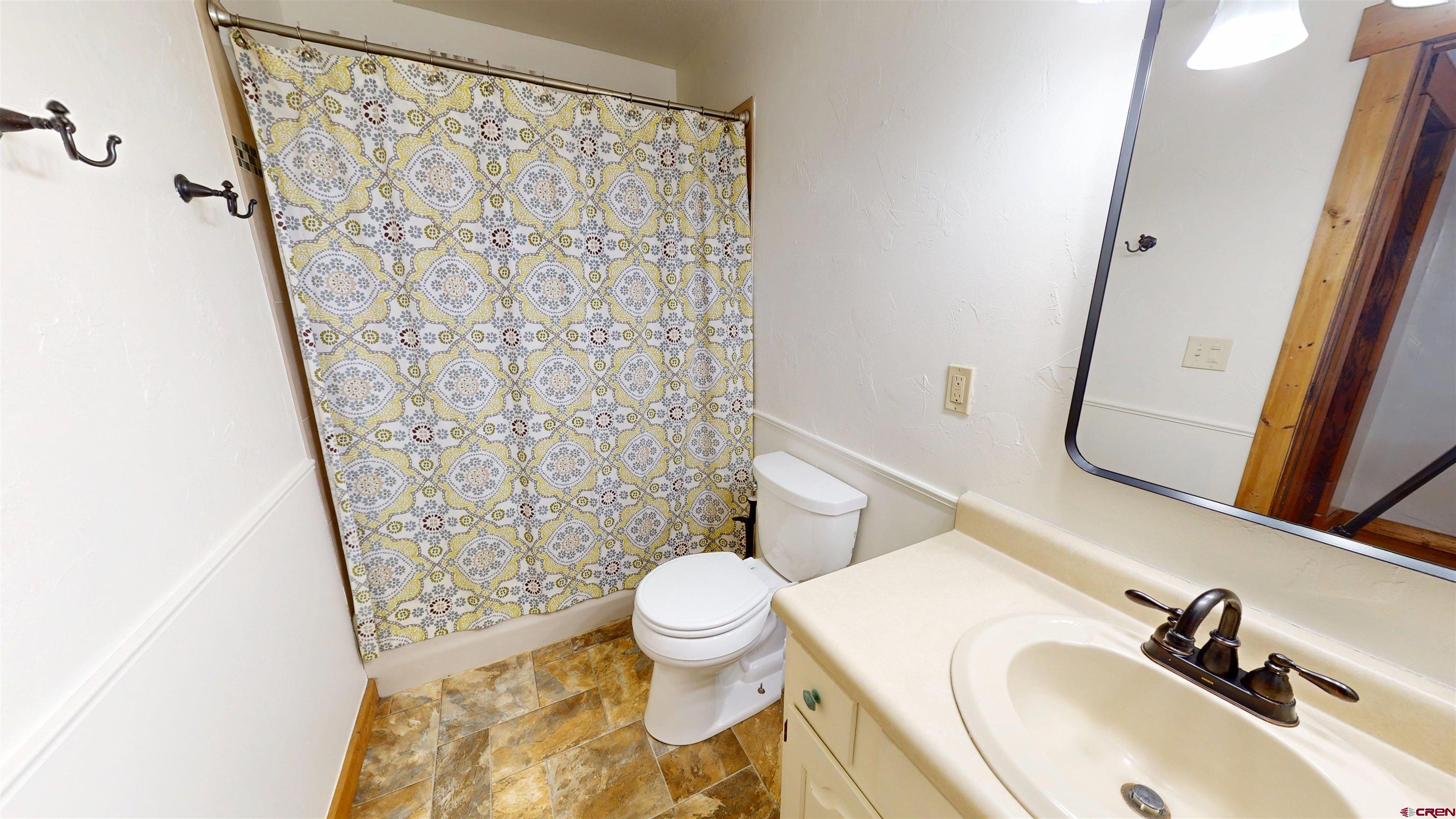577 Pashuta Drive Gunnison, CO 81230 - Photo 20 of 41 a bathroom with a sink and a mirror