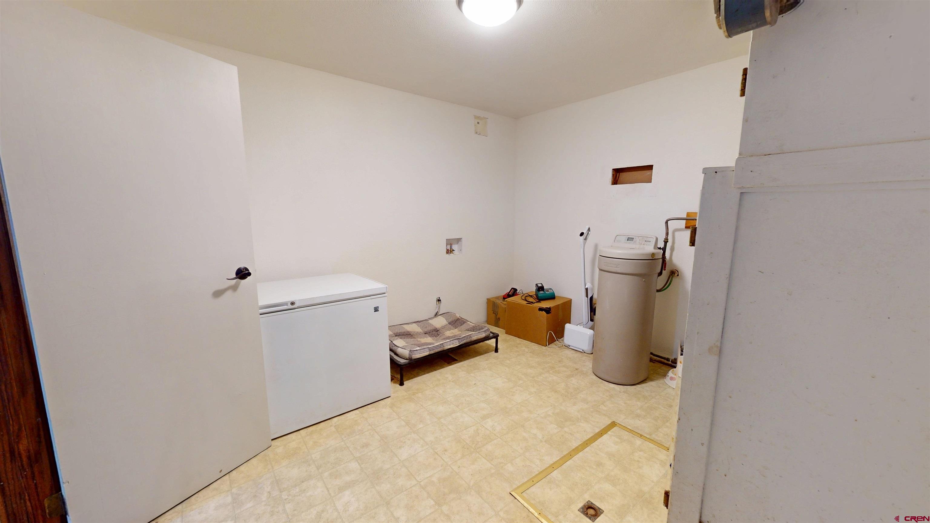 577 Pashuta Drive Gunnison, CO 81230 - Photo 21 of 41 a view of a storage & utility room with two washing machine