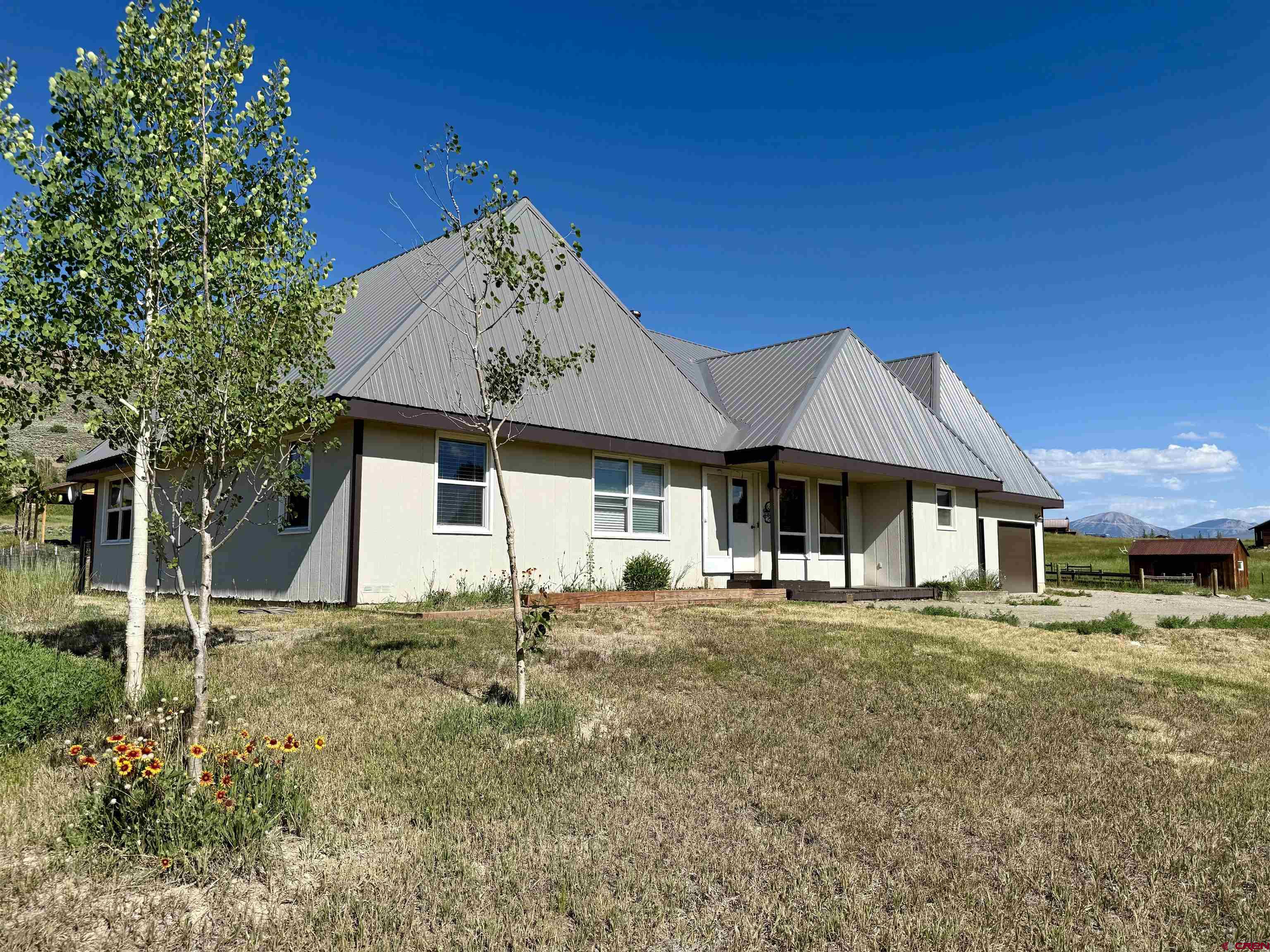 577 Pashuta Drive Gunnison, CO 81230 - Photo 31 of 41 a front view of a house with a yard