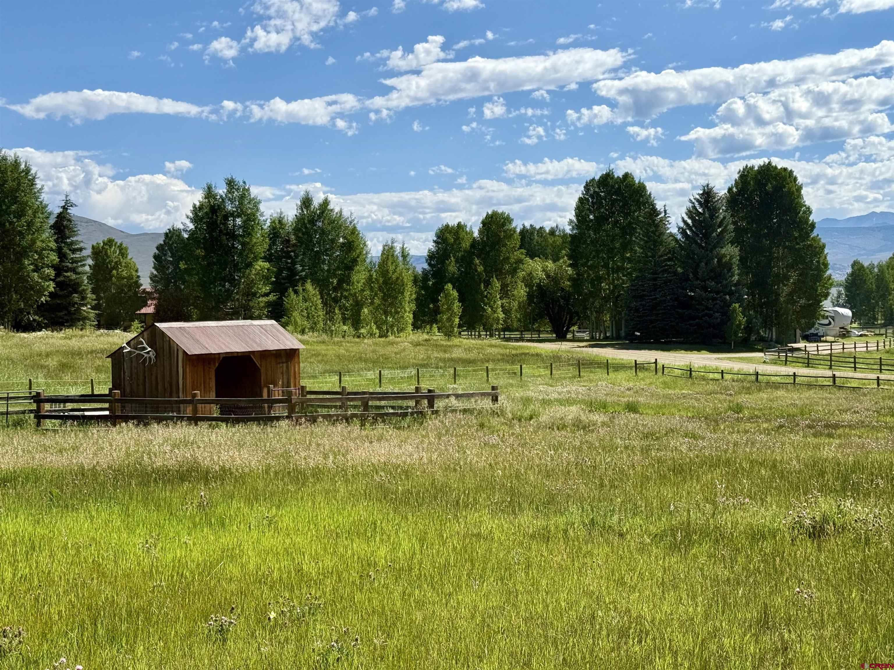 577 Pashuta Drive Gunnison, CO 81230 - Photo 37 of 41 a view of a golf course with a lake view